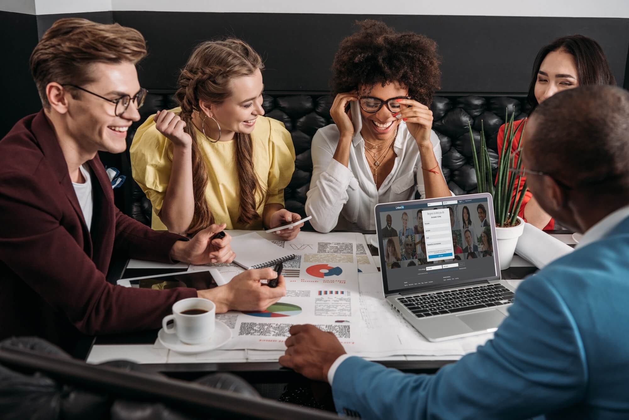 young-group-of-business-colleagues-working-together-in-cafe.jpg